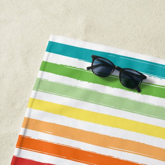 Regenboogstrips monogram strandlaken (In situ)