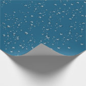 regendruppels op blauw cadeaupapier (Hoek)