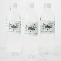 Reiswaterfleslabel met vintage vliegtuigmotief voo