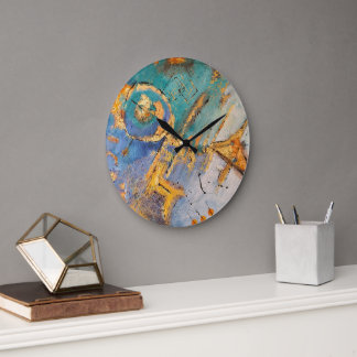 reloj abstracto con tonos azules y oro  grote klok