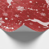 rendieren en sneeuwvlokken op rode achtergrond cadeaupapier (Hoek)
