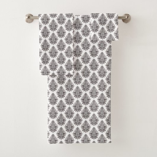 Repeating black floral pattern towel bad handdoek