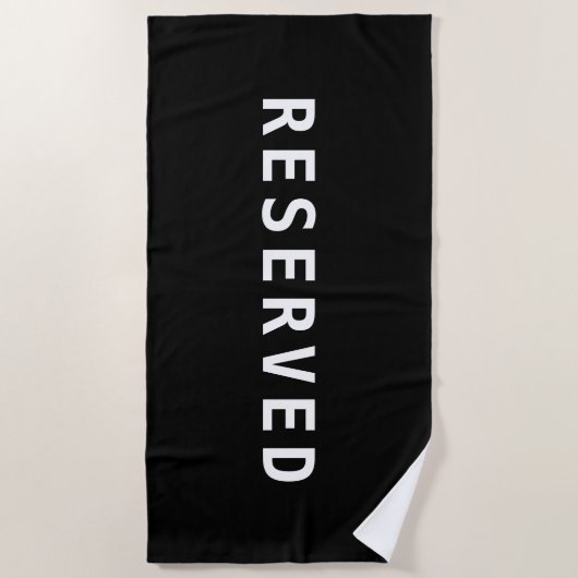 RESERVED, witte tekst op zwarte handdoek (Voorkant)