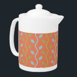 Retro Blue- en groene wijnstokken op Oranje Floral Theepot<br><div class="desc">Folksy en plezier zijn de woorden die je in gedachten krijgt als je kijkt naar deze zoete retroblauwe en groene wijnstokken op een oranje bloempatroon. Oh zo schattig en super schattig ook. Dit klassieke minimalistische wijnstokpatroon vertaalt perfect naar zowel mode- als home decor-items. Het perfecte geschenk voor een enthousiaste periode...</div>