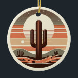 Retro Boho Saguaro Cactus Desert Sunset Ornament<br><div class="desc">Bring the warmth of the Southwest to your holiday decor with this stylish Mid-Century Modern cactus ornament. Featuring a minimalist Saguaro silhouette against a vibrant, striped desert sunset, this design blends vintage 70s vibes with contemporary boho flair. Perfect for desert lovers, nature enthusiasts, or anyone looking to add a unique,...</div>