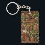 Retro book lover art sleutelhanger<br><div class="desc">A cozy retro-inspired design featuring a charming bookshelf filled with vintage books, delicate botanical accents, and a comforting cup of tea or coffee.</div>