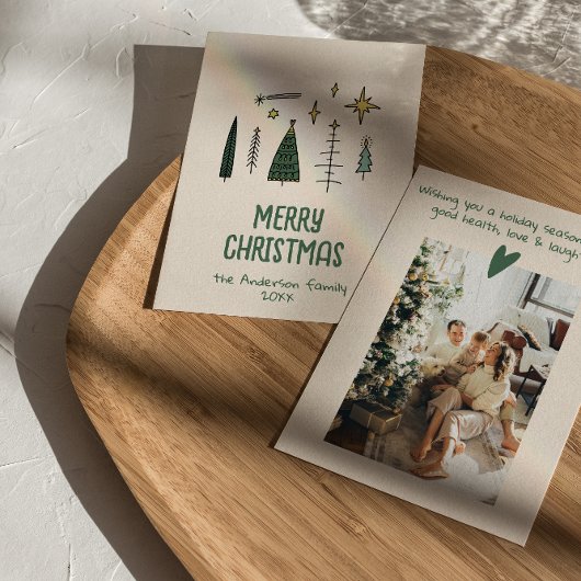 Retro handgeschilderde getekende groene kerstbomen feestdagenkaart