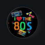 Retro I Love | Eighties Ronde Button 5,7 Cm<br><div class="desc">Fun and colorful 80's black button,  featuring bright neon colored text saying "i love the eighties",  a cassette tape,  bright retro sunglasses,  a ghetto blaster (boombox),  and a few scattered stars.</div>