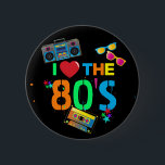 Retro I Love | Eighties Ronde Button 5,7 Cm<br><div class="desc">Fun and colorful 80's black button,  featuring bright neon colored text saying "i love the eighties",  a cassette tape,  bright retro sunglasses,  a ghetto blaster (boombox),  and a few scattered stars.</div>