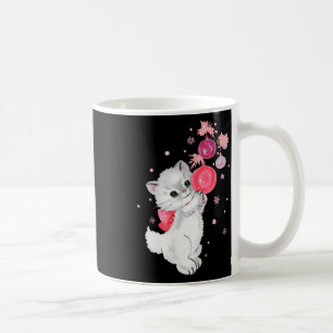 Retro kat kitten speelt met roze kerst ornamen koffiemok