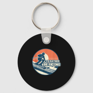 Retro skisilhouet ontwerp met zonsondergang verloo sleutelhanger