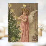 Retro Vintage Christmas Angel Kerstboom Feestdagenkaart<br><div class="desc">Een leuke,  retro Victoriaans Vintage Christmas Kaart met een engel in een roze jurk die bidt bij een verlichte top versierde kerstboom.</div>