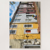 Rij van oude kleurrijke houten huizen legpuzzel (Verticaal)