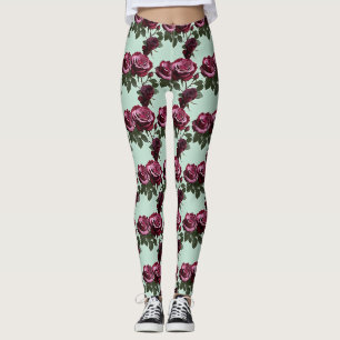 Rijke paarse en dieprode rozen op een mintgroene a leggings