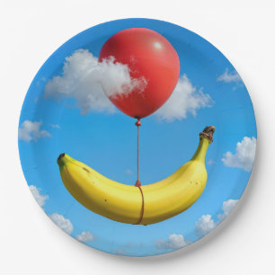 Rijpe banaan zwevend in de lucht met rode ballon papieren bordje