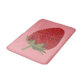 Rijpe rode aardbei op roze geïllustreerd badmat (Gekanteld)