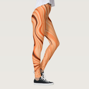 Rimpels in schoppen van oranje, gebogen bruine cil leggings