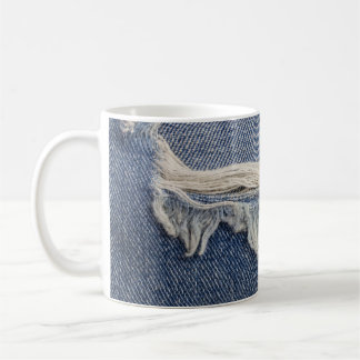 Ripped jeans textuur, stijlvolle achtergrond. koffiemok
