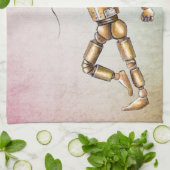 Robot die een keukenhanddoek voor een rode ballon  (Gevouwen)