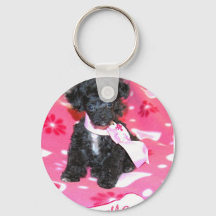 Robuuste puppy in roze sleutelhanger