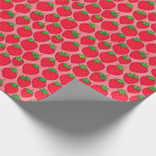Rode aardbeien op roze cadeaupapier (Hoek)