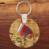 Rode accordeon, zwarte noten, gouden achtergrond sleutelhanger (Voorkant)