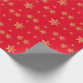 Rode achtergrondgouden sterren die papier verpakke (Hoek)