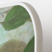 Rode appels op groen pickleball paddle (Links Detail)