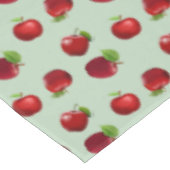 Rode appels op lichtgroene tablet tafelkleed (Gekanteld)