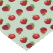 Rode appels op lichtgroene tafelkleed (Gekanteld)