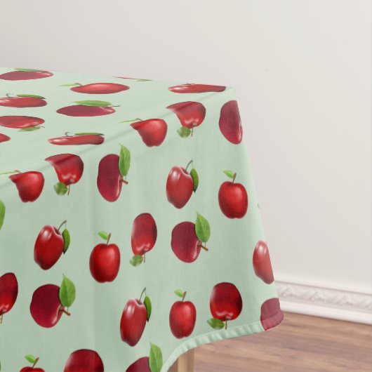 Rode appels op lichtgroene tafelkleed (Voorbeeld)