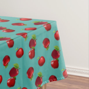 Rode appels op smaragdgroene tafelkleed
