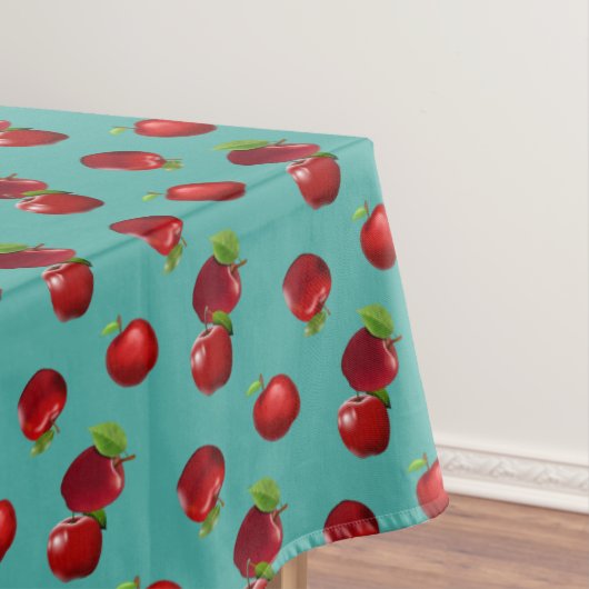 Rode appels op smaragdgroene tafelkleed (Voorbeeld)