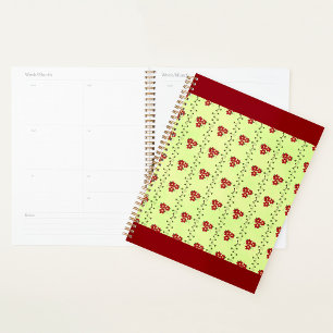 Rode bloemrank patroon op lichtgroen planner