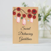 Rode bloemschikking in landelijke stijl in een wec informatiekaartje (Staand voorkant)