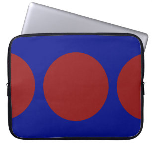 Rode cirkels op blauw laptop sleeve