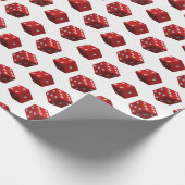 Rode dobbelstenen op wit cadeaupapier (Hoek)