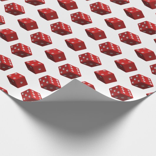 Rode dobbelstenen op wit cadeaupapier (Hoek)