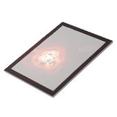 Rode dwergster in een baan rond een hypothetische  notitieblok (Schuin)