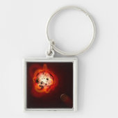 Rode dwergster in een baan rond een hypothetische sleutelhanger (Voorkant)