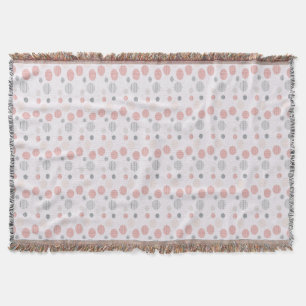 Rode en blauwe cirkels op wit deken