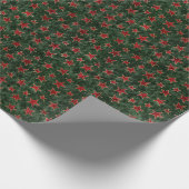 Rode en gouden sterren op groene vetvetten cadeaupapier (Hoek)