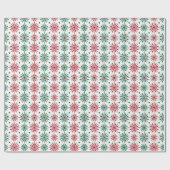 Rode en groene kerstsneeuwvlokken op wit cadeaupapier (Vlak)