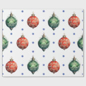 Rode en groene kerstversieringen op wit cadeaupapier (Vlak)
