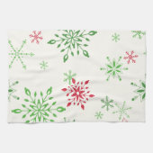 Rode en groene sneeuwvlokken op een witte achtergr theedoek (Horizontaal)