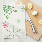 Rode en groene sneeuwvlokken op een witte achtergr theedoek (Quarter Fold)
