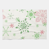 Rode en groene sneeuwvlokken op een witte achtergr theedoek (Horizontaal)