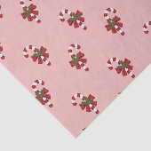 Rode en witte kerst snoepriet patroon op roze tissuepapier (Detail)