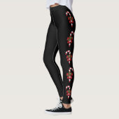 Rode en witte kerstsnoepjes op zwart leggings (Links)