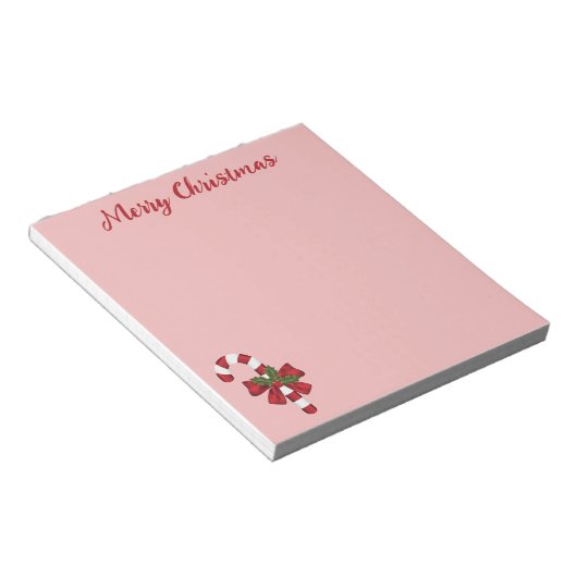 Rode en witte kerstsnoepriet en aangepaste tekst notitieblok (Schuin)